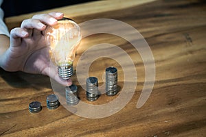 saving coins idea with light bulb for investment Concept idea and innovation