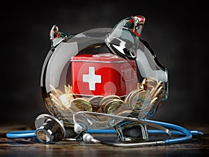 Saving for healthcare and medicine, health insurance concept. Piggy bank with coins, medication and stethoscope.