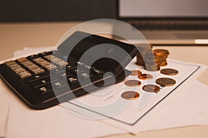 Saving money concept,graph, stacks of coins ,chart and pen ,copy space.selective focus,vintage color