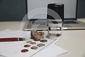 Saving money concept,graph, stacks of coins ,chart and pen ,copy space.selective focus,vintage color