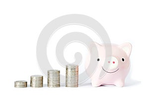 Saving money concept, Piggy bank and coins stacks on white background