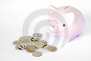 Saving money concept, Piggy bank and coins stacks on white background