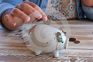 Saving money, girl with piggy bank