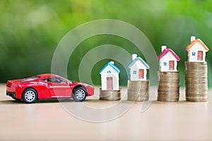 Saving money for house and car that stack gold coin growing ,saving money or money growth concept.