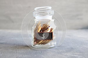 Saving money jar. Golden coins.