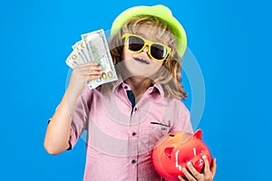Saving money for travel. Dollars money and piggybank concept. Kid saving money in a piggy bank, learning about saving