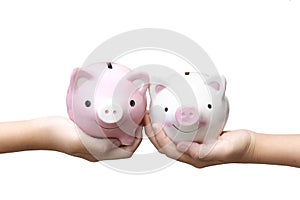Two kids holding piggy banks