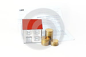 Saving plan concept with paper house and coins stack