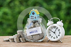 saving property or long term mortgage concept as glass jar with