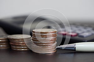 Saving stack coins money concept for Business Finance with pen,