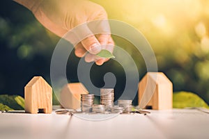 Saving to buy a house or home savings concept with money coin stack growing.