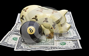 Savings behind eight ball investment money piggy bank