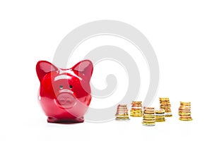 Savings and Finances Concepts.Piggybank Along With Coins Stacks. Isolated on White Background