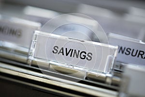 Savings heading in filing cabinet