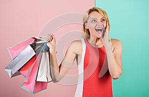 Savings on purchases. happy woman shopper. big sale. female shopaholic hold shopping bags. present packages for holiday