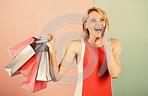 Savings on purchases. happy woman shopper. big sale. female shopaholic hold shopping bags. present packages for holiday