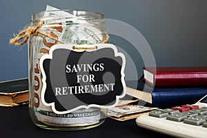 Savings for retirement sign on the jar with money