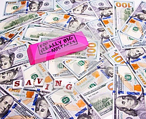 Savings: Scattered hundred dollar bills with a pink eraser for really big mistakes