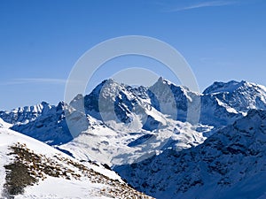 Savognin: snow-covered mountains and ski slopes