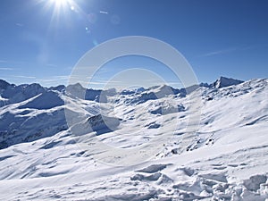 Savognin: snow-covered mountains and ski slopes