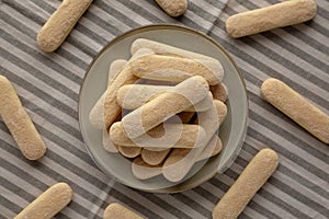 Savoiardi biscuits on a plate, top view