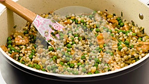 A savory blend of pearled couscous, orzo, baby garbanzo beans, red quinoa, shrimp, green peas