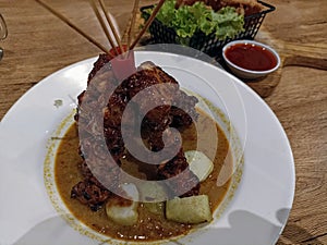 Savory Chicken Satay & Lontong in Sauce