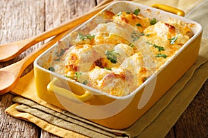 Savory food: baked cauliflower with cheese, eggs and cream close