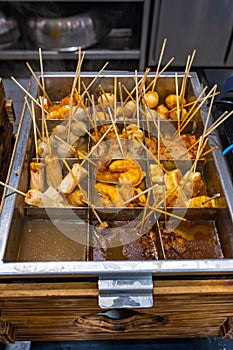 Savory Japanese cuisine oden-meat ball and nugget stick in soup