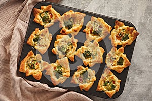 Savory puff pastry muffins with broccoli and mozzarella