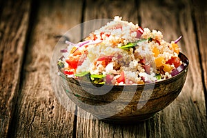 Savory quinoa with herbs, peppers and tomato