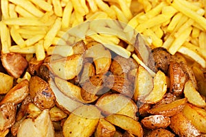 Savory roasted potatoes and french fries. background. Easy vegetable side dish cooked with potatoes. Closeup