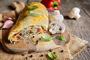 Savory strudel with mushrooms, red pepper, onion, garlic and parsley