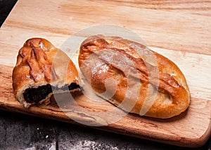 Savory stuffed patties on a Board on black baking tray. Country house style. Authentically