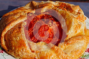 A savory tomato galette on a plate