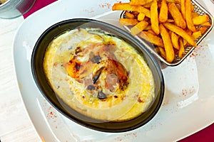 Savoyard escalope with turkey, bacon, reblochon in creamy sauce with fries