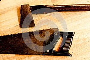 Saw and axe for carpenter on wooden background tool woodcraft object