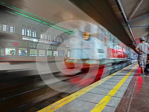 Saw a speeding train in the station at night