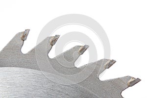 Saw teeth of circular saw on white background photo