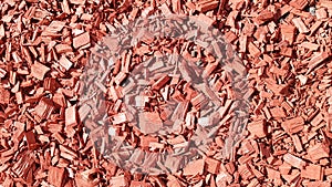 Sawdust for the garden. Texture of tree bark lying on the ground. Background from a tree bark. Decorative bark, mulch, mulching.