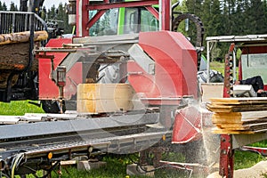Sawing boards with a machine industry