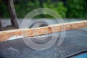 Sawing wood on a small machine