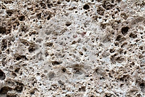 Sawn Armenian tuff, travertine. The porous surface of the stone with large recesses. Tuff Stone Sawn Cut Callibrated