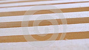 Sawn boards lie on the floor parallel to each other for drying. Preparation for the installation of an eco-friendly wooden floor i