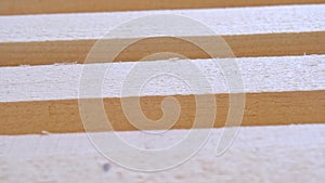 Sawn boards lie on the floor parallel to each other for drying. Preparation for the installation of an eco-friendly wooden floor i