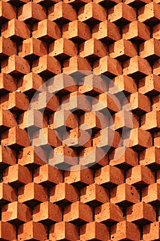 Sawtooth pattern brickwork. Decorative red brick wall as background