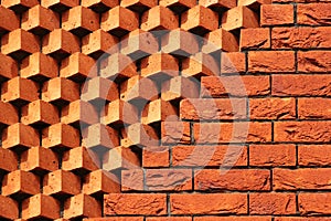 Sawtooth pattern brickwork. Decorative red brick wall as background