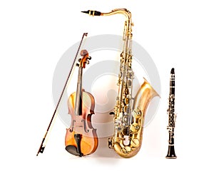 Sax tenor saxophone violin and clarinet in white photo