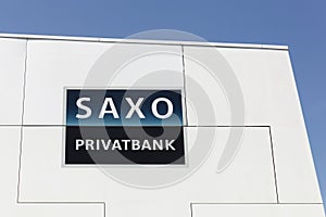 Saxo Bank logo on a wall