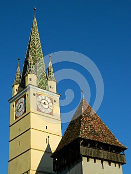 Saxon tower with smaller tower nextt to it in Medias, Romania photo